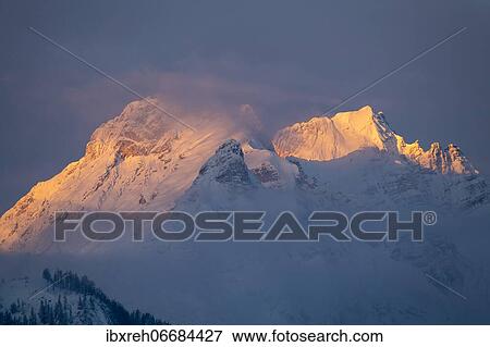 Small and large beggar's litter in winter, at sunrise, Karwendel Mountains, Terfens, Tyrol, Austria, Europe View Large Photo Image Stock Photo - Small and large beggar's litter in winter, at sunrise, Karwendel Mountains, Terfens, Tyrol, Austria, Europe. Fotosearch