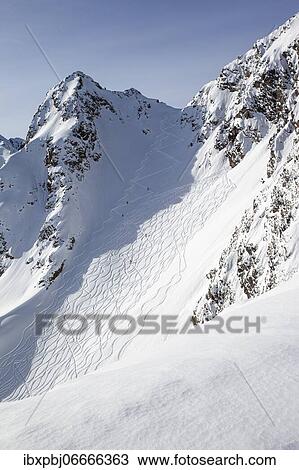 Stock Image - Snowy mountain, ascent track with hairpin bends, Zischgeles, Stubai Alps, Tyrol, Austria, Europe. Fotosearch