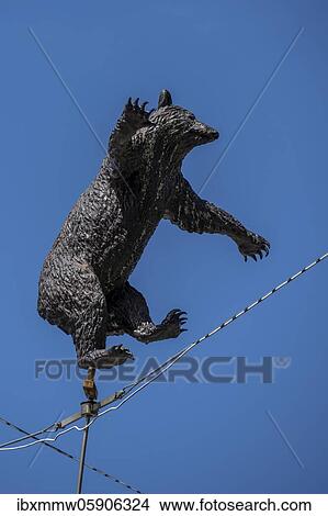 Picture - Statue of the Bernese bear dancing on a rope, heraldic animal, at the Bear Pit, Bern, Canton Bern, Switzerland, Europe. Fotosearch
