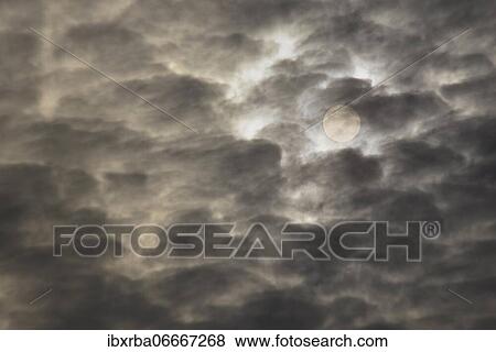 Sun shines through cloudy sky, North Rhine-Westphalia, Germany, Europe View Large Photo Image Stock Photo - Sun shines through cloudy sky, North Rhine-Westphalia, Germany, Europe. Fotosearch