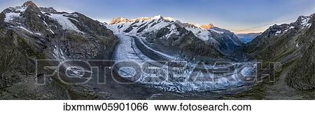 Sunrise, left Schreckhorn hut and Schreckhorn, middle Finsteraarhorn, Agassizhorn, Großes Fiescherhorn, right Mönch and Eiger, upper ice sea, mountain panorama, high alpine landscape with mountains and glacier, Bernese Oberland, Switzerland, Europe View Large Photo Image Stock Photograph - Sunrise, left Schreckhorn hut and Schreckhorn, middle Finsteraarhorn, Agassizhorn, Großes Fiescherhorn, right Mönch and Eiger, upper ice sea, mountain panorama, high alpine landscape with mountains and glacier, Bernese Oberland, Switzerland, Europe. Fotosearch