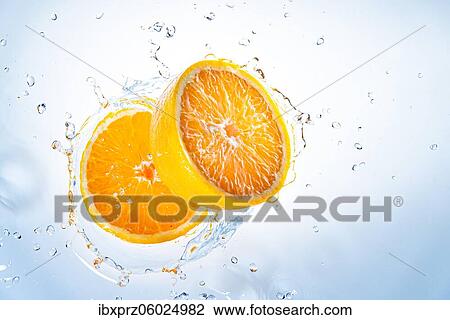 Two halves of oranges fall into water, with splashes of water, light background View Large Photo Image Stock Image - Two halves of oranges fall into water, with splashes of water, light background. Fotosearch