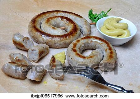 Vaudois barbecue snail and bowl of mustard, roasted, bratwurst, Switzerland, Europe View Large Photo Image Stock Photograph - Vaudois barbecue snail and bowl of mustard, roasted, bratwurst, Switzerland, Europe. Fotosearch