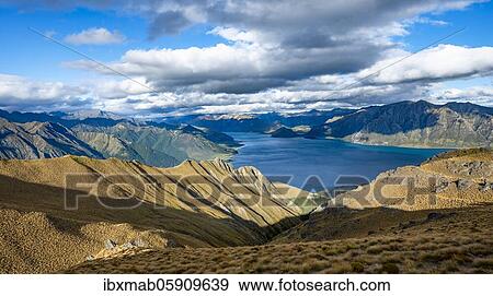 View of Lake Hawea, lake and mountain landscape, view from Isthmus Peak, Otago, South Island, New Zealand, Oceania View Large Photo Image Stock Photo - View of Lake Hawea, lake and mountain landscape, view from Isthmus Peak, Otago, South Island, New Zealand, Oceania. Fotosearch