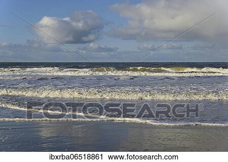 Waves on a sandy beach with foam formation, blue sky with deep swelling clouds (cumulus) over the North Sea, Norderney, East Frisian Islands, Lower Saxony, Germany, Europe View Large Photo Image Stock Image - Waves on a sandy beach with foam formation, blue sky with deep swelling clouds (cumulus) over the North Sea, Norderney, East Frisian Islands, Lower Saxony, Germany, Europe. Fotosearch