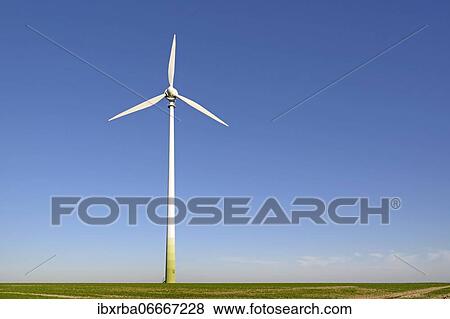 Wind turbine at a field in front of a blue sky, North Rhine-Westphalia, Germany, Europe View Large Photo Image Stock Photo - Wind turbine at a field in front of a blue sky, North Rhine-Westphalia, Germany, Europe. Fotosearch