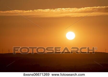 Wind turbines standing on a hill at sunrise, Timmenrode, Saxony-Anhalt, Germany, Europe View Large Photo Image Stock Photo - Wind turbines standing on a hill at sunrise, Timmenrode, Saxony-Anhalt, Germany, Europe. Fotosearch