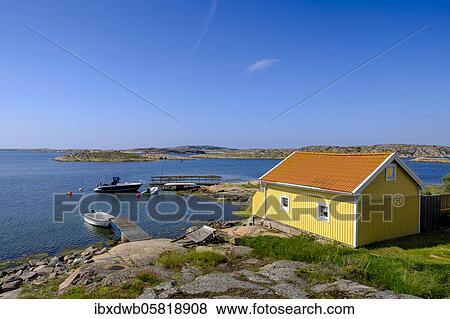 Yellow cottage on the rocky coast near Kungsham, archipelago, Bohuslän province, Västra Götalands län province, southern Sweden, Sweden, Europe View Large Photo Image Stock Photo - Yellow cottage on the rocky coast near Kungsham, archipelago, Bohuslän province, Västra Götalands län province, southern Sweden, Sweden, Europe. Fotosearch
