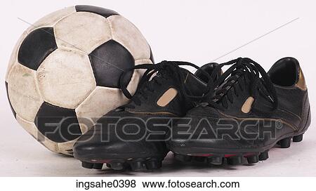 Stock Photo - Black cleats and soccer ball 2. Fotosearch