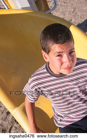 Stock Photograph - Boy on slide 0001. Fotosearch