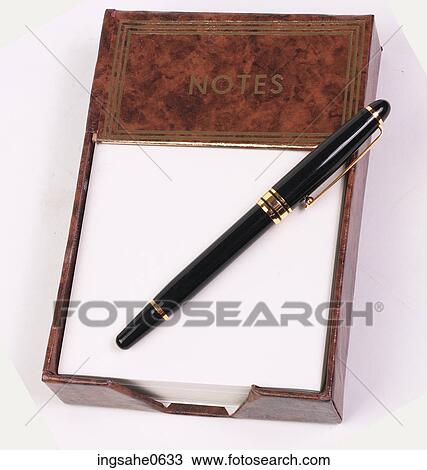 Stock Image - Brown note pad and pen L3. Fotosearch