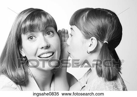 Daughter telling her mother a secret View Large Photo Image Stock Photography - Daughter telling her mother a secret. Fotosearch