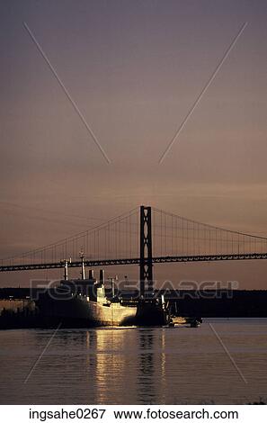 Stock Photo - Freighters under bridge . Fotosearch