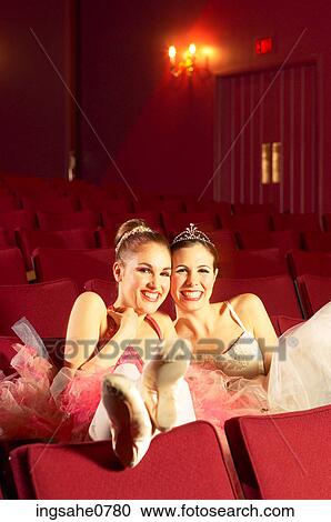 Giggling ballerinas sitting in empty theater 1 View Large Photo Image Stock Image - Giggling ballerinas sitting in empty theater 1. Fotosearch