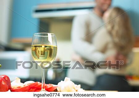 Glass of white wine in kitchen View Large Photo Image Picture - Glass of white wine in kitchen. Fotosearch