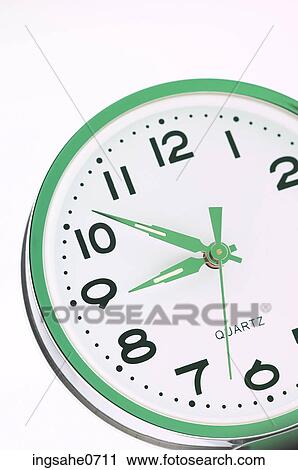 Green and white clock on white surface View Large Photo Image Stock Image - Green and white clock on white surface. Fotosearch
