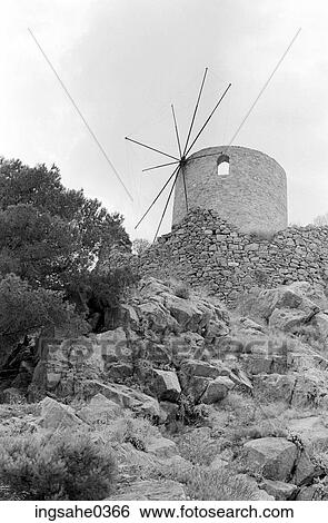 Hill with broken down wind mill View Large Photo Image Stock Photograph - Hill with broken down wind mill . Fotosearch