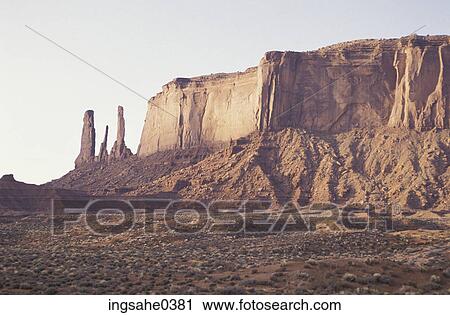 Stock Image - Large buttes and cliff in desert . Fotosearch