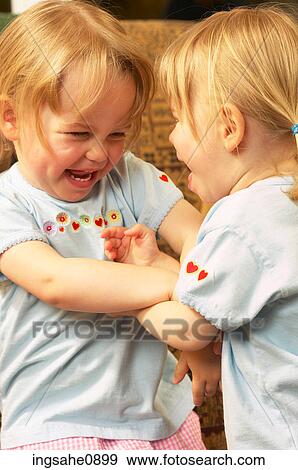 Laughing little girls View Large Photo Image Stock Photo - Laughing little girls. Fotosearch