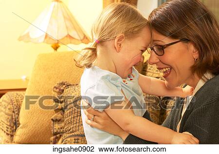Laughing mother and daughter View Large Photo Image Stock Image - Laughing mother and daughter. Fotosearch