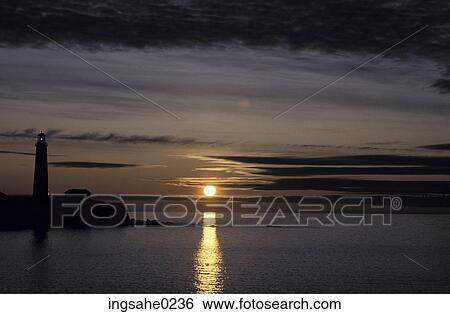 Lighthouse at sunset View Large Photo Image Stock Photograph - Lighthouse at sunset . Fotosearch