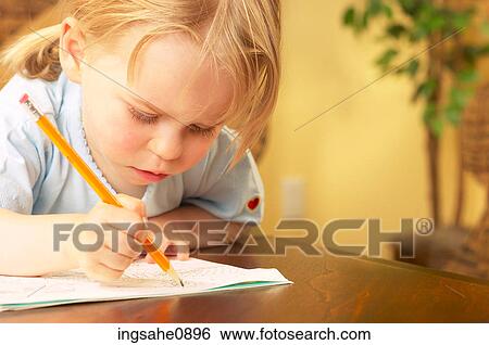 Stock Photograph - Little girl drawing a picture 2. Fotosearch