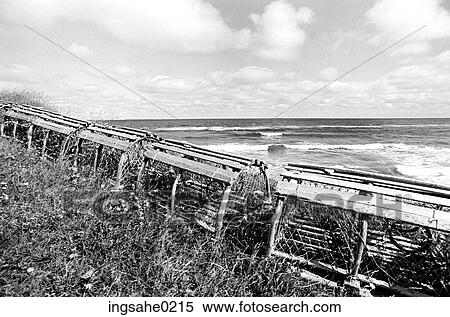 Lobster traps with waves in background View Large Photo Image Stock Photography - Lobster traps with waves in background . Fotosearch