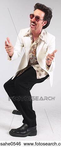 Man dancing in seventies-style clothes View Large Photo Image Stock Photograph - Man dancing in seventies-style clothes. Fotosearch