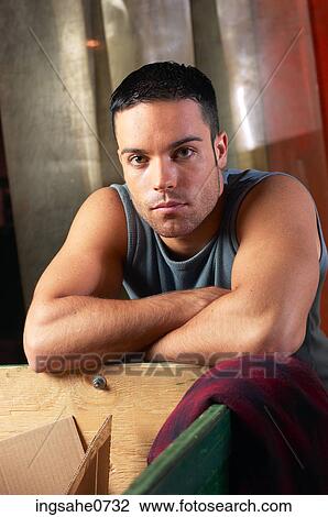 Man leaning on board View Large Photo Image Stock Image - Man leaning on board. Fotosearch