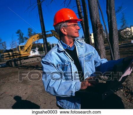 man with laptop on construction site 0001 View Large Photo Image Stock Image - man with laptop on construction site 0001. Fotosearch