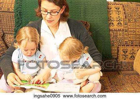Mother reading story with twin little girls 2 View Large Photo Image Stock Photography - Mother reading story with twin little girls 2. Fotosearch