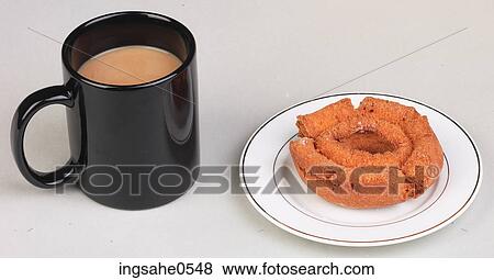Mug of coffee and doughnut View Large Photo Image Stock Photo - Mug of coffee and doughnut. Fotosearch