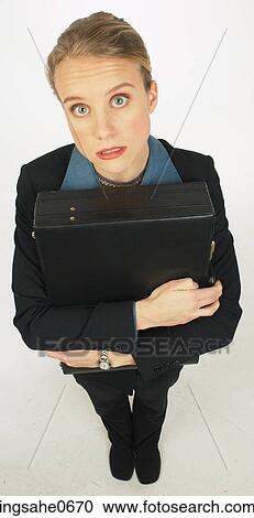 Nervous businesswoman hugging briefcase L3 View Large Photo Image Stock Image - Nervous businesswoman hugging briefcase L3. Fotosearch
