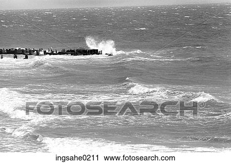 Ocean crashing against abandoned pier View Large Photo Image Stock Image - Ocean crashing against abandoned pier . Fotosearch