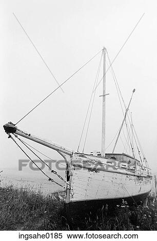 Stock Photography - Old abandoned boat on seashore . Fotosearch