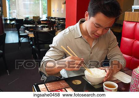 Stock Photo - Person eating lunch 0001. Fotosearch