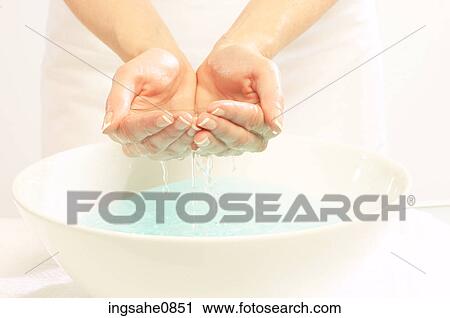 Person washing their face in basin 1 View Large Photo Image Stock Image - Person washing their face in basin 1. Fotosearch