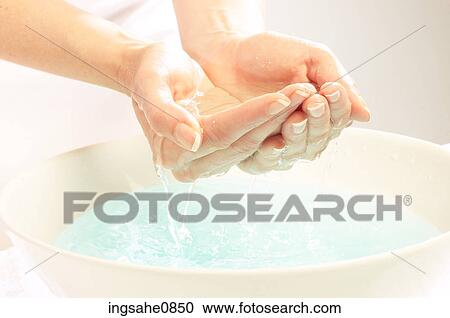 Person washing their face in basin View Large Photo Image Stock Image - Person washing their face in basin. Fotosearch