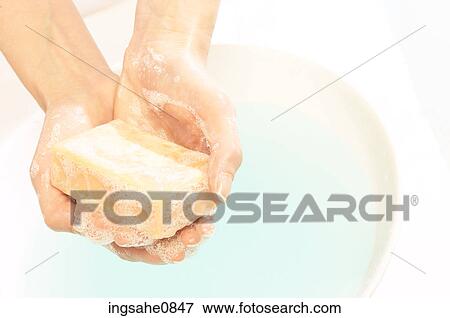 Person washing their hands with bar of soap 2 View Large Photo Image Stock Photo - Person washing their hands with bar of soap 2. Fotosearch