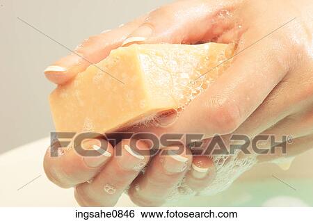 Person washing their hands with bar of soap View Large Photo Image Stock Photograph - Person washing their hands with bar of soap. Fotosearch