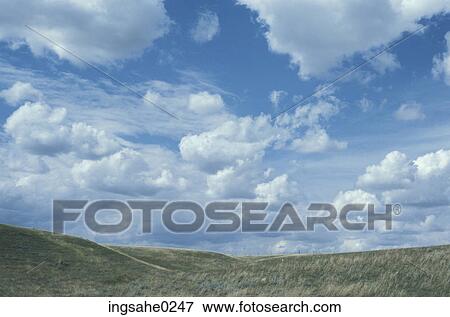 Prairie and hills under clouds View Large Photo Image Stock Photo - Prairie and hills under clouds . Fotosearch