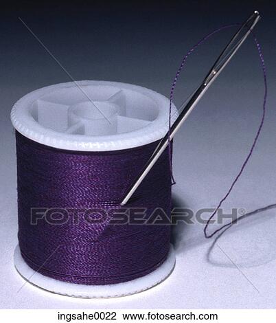 Stock Image - purple spool of thread . Fotosearch