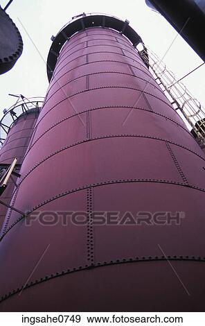 Stock Photo - Red rusty metal smokestack of factory building. Fotosearch