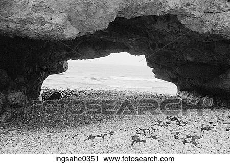 Rock arch with beach View Large Photo Image Stock Image - Rock arch with beach . Fotosearch