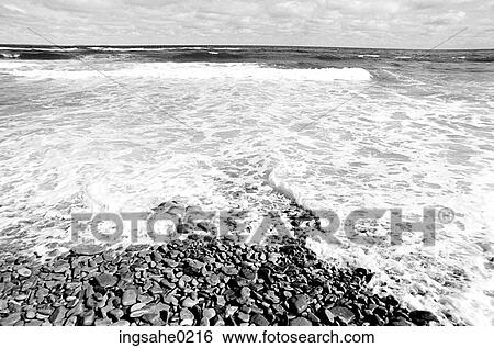 Rocky beach with waves View Large Photo Image Stock Photograph - Rocky beach with waves . Fotosearch