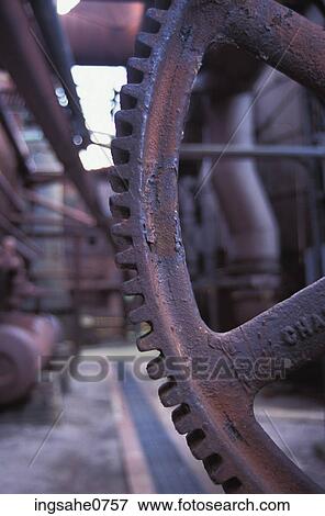 Stock Photo - Rusty metal machinery gear. Fotosearch