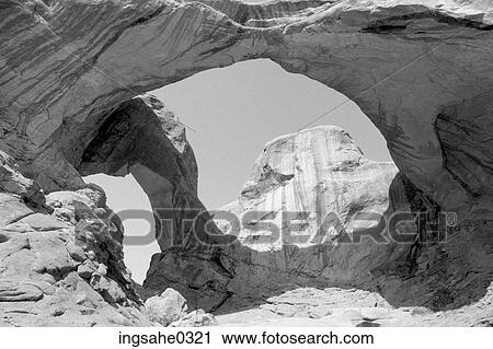 Sandstone arch with butte View Large Photo Image Stock Image - Sandstone arch with butte . Fotosearch