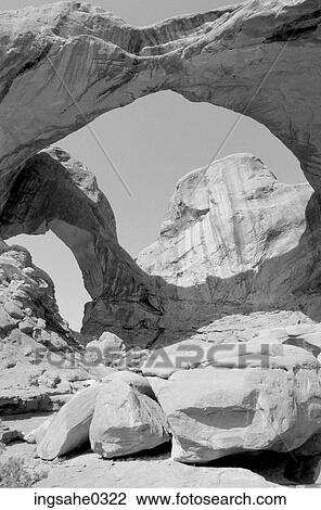 Sandstone arch with butte View Large Photo Image Stock Image - Sandstone arch with butte . Fotosearch