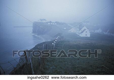 Seaside village on cliff in fog View Large Photo Image Stock Image - Seaside village on cliff in fog . Fotosearch