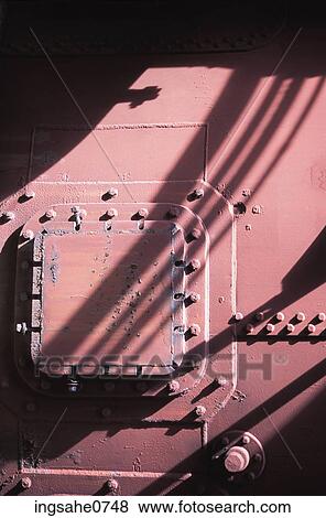 Shadows on red metal machinery View Large Photo Image Stock Photo - Shadows on red metal machinery. Fotosearch